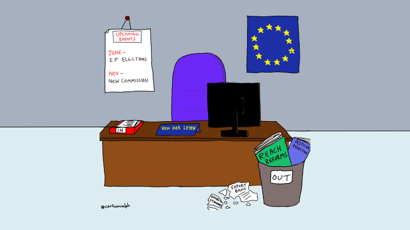 This cartoon shows an office and a desk labelled “Von der Leyen” with an in-tray. Near the desk on the floor is a waste paper bin labelled “out” and inside and around it we see crumpled papers “REACH reforms”, “pesticide reduction”, “export bans”. On the wall behind the desk is an EU flag. There is also a calendar which highlights the EP elections in June and the new Commission in November. 