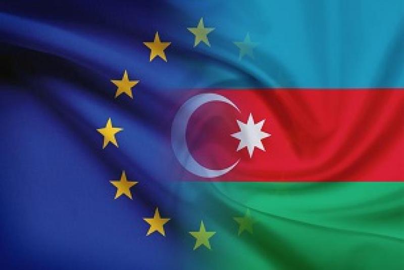 Flags of Azerbaijan and EU merging into one another