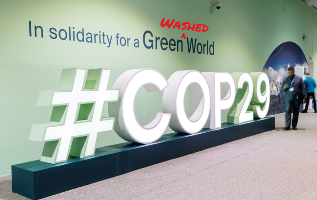 COP29 slogan subverted to read "In solidarity for a Greenwashed World"